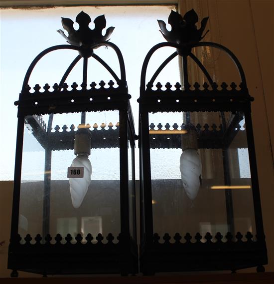 Pair of black painted lanterns